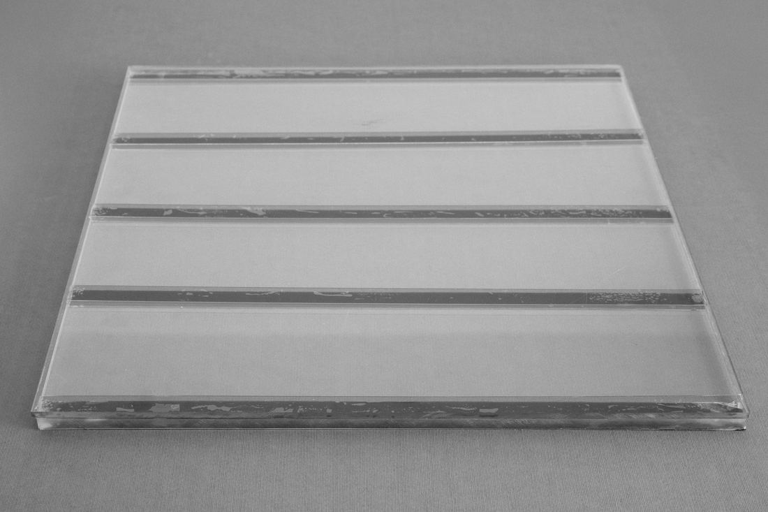 FTL 600 PET security laminate — roll edge showing film gauge