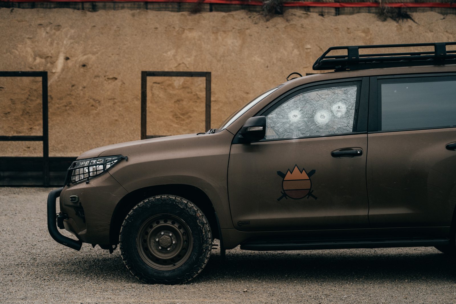 Fortis-armoured Toyota Land Cruiser — side window with rounds stopped at the range
